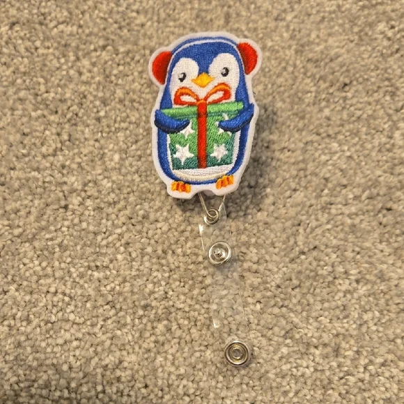 Penguin Badge Reel with Gift Design - Picture 1 of 2